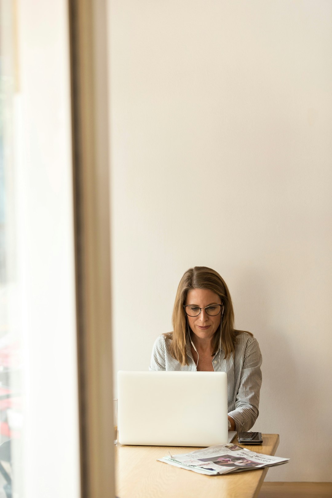 Sales rep sitting at a laptop researching a prospect ahead of a call, illustrating the buyer prep gap