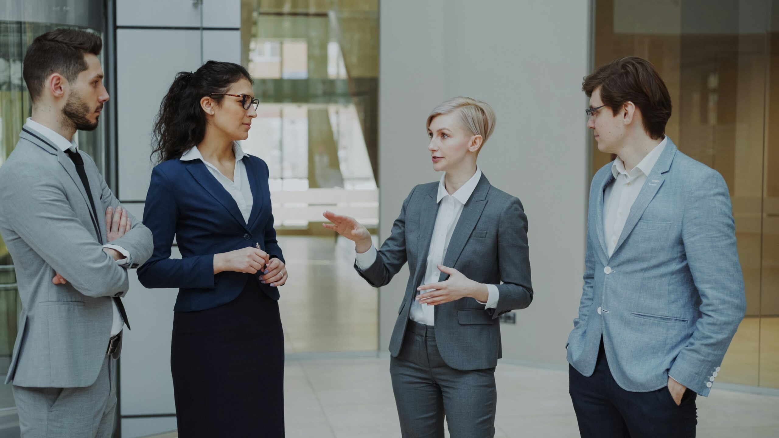 Businesswoman confidently discussing a deal with colleagues, representing personalized sales roleplay practice