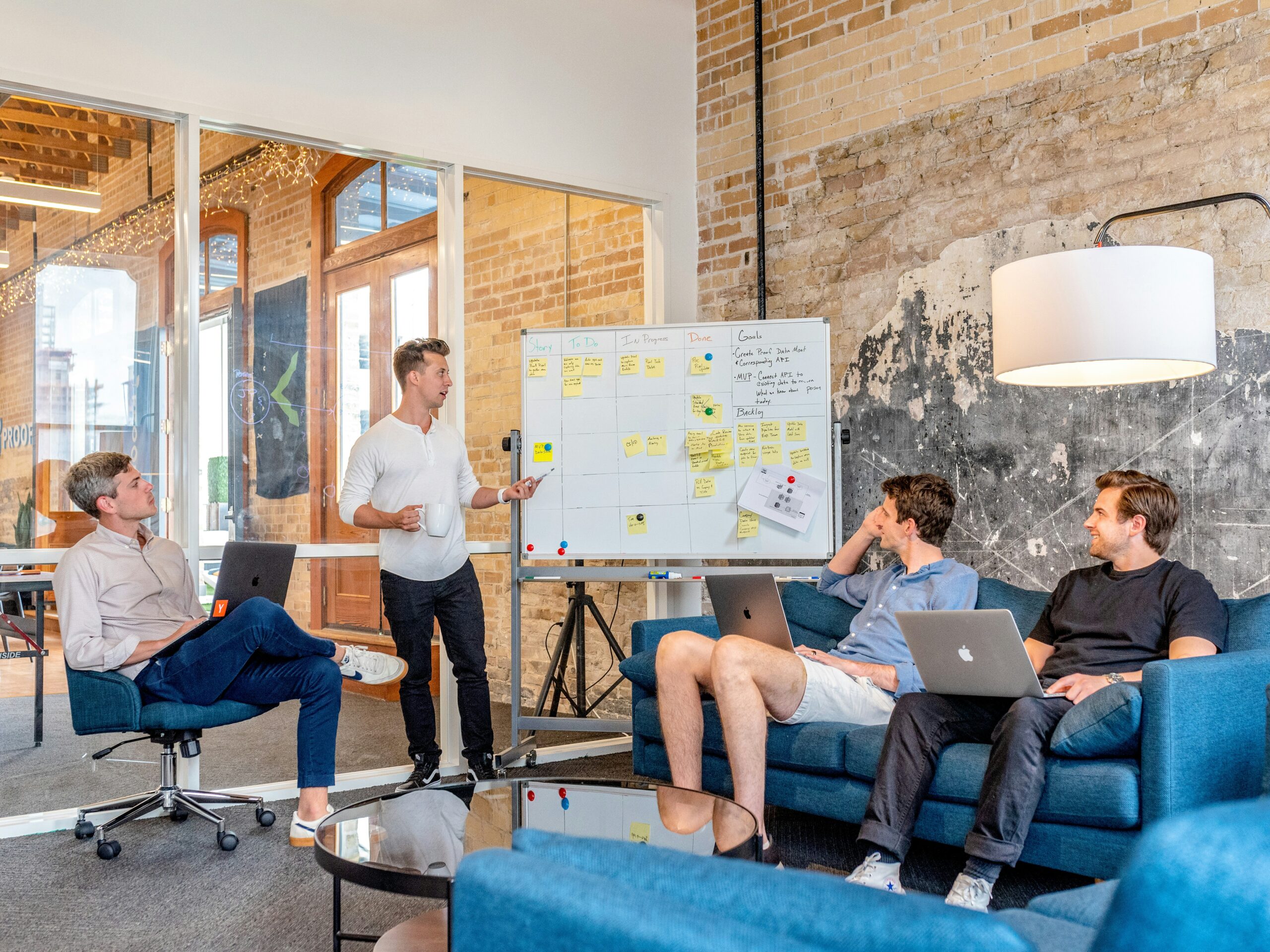 Sales reps reviewing a whiteboard strategy before an enterprise discovery call