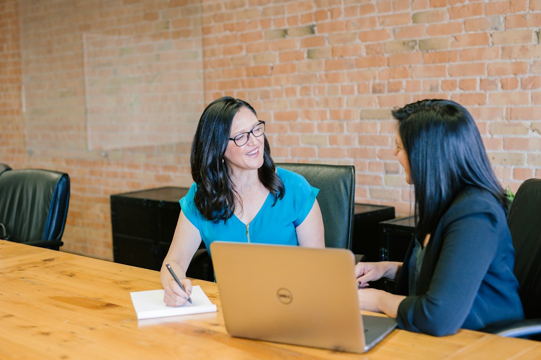 Sales manager coaching a rep in a one on one review